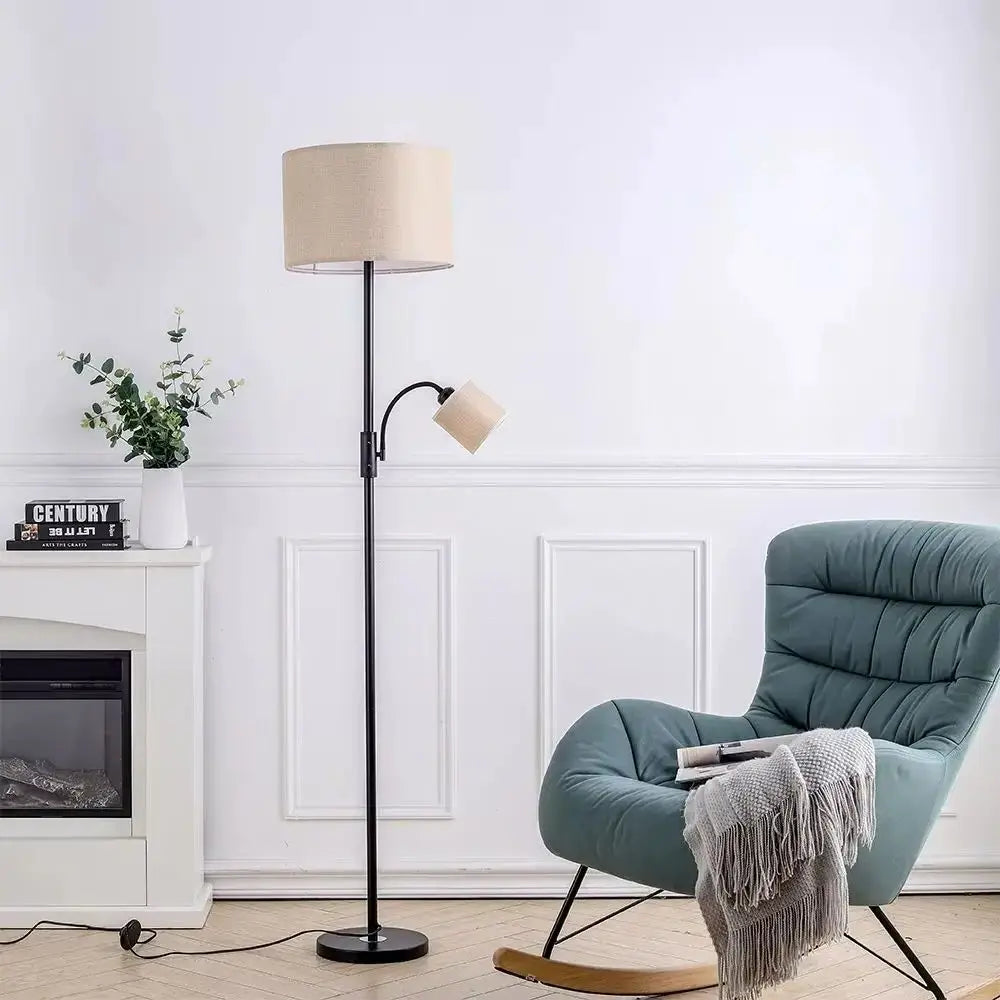 Living room with a floor lamp and a blue armchair.