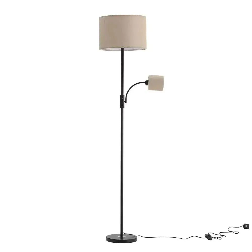 Floor lamp with beige shade and reading light on a white background
