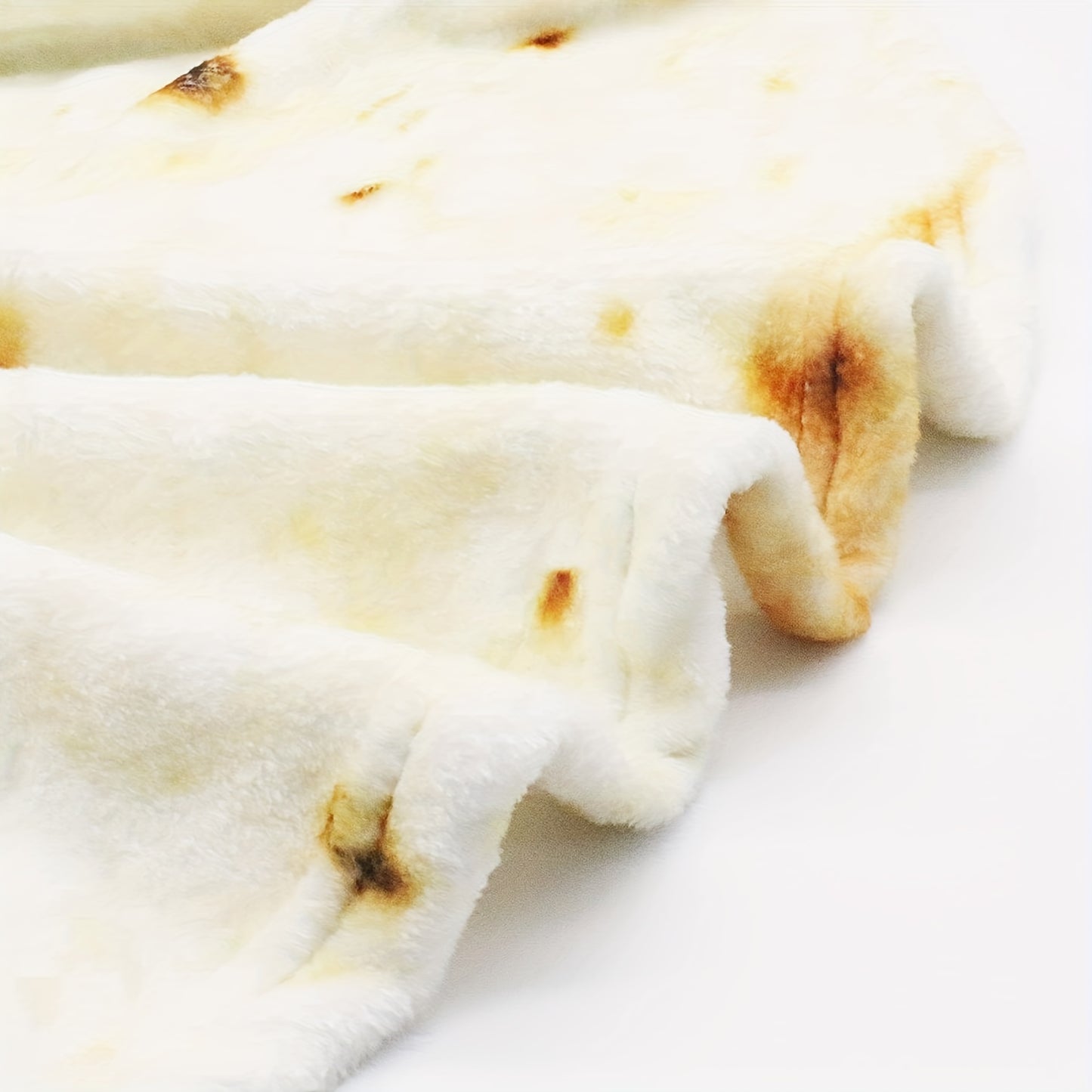 Close-up of a folded flatbread on a white background