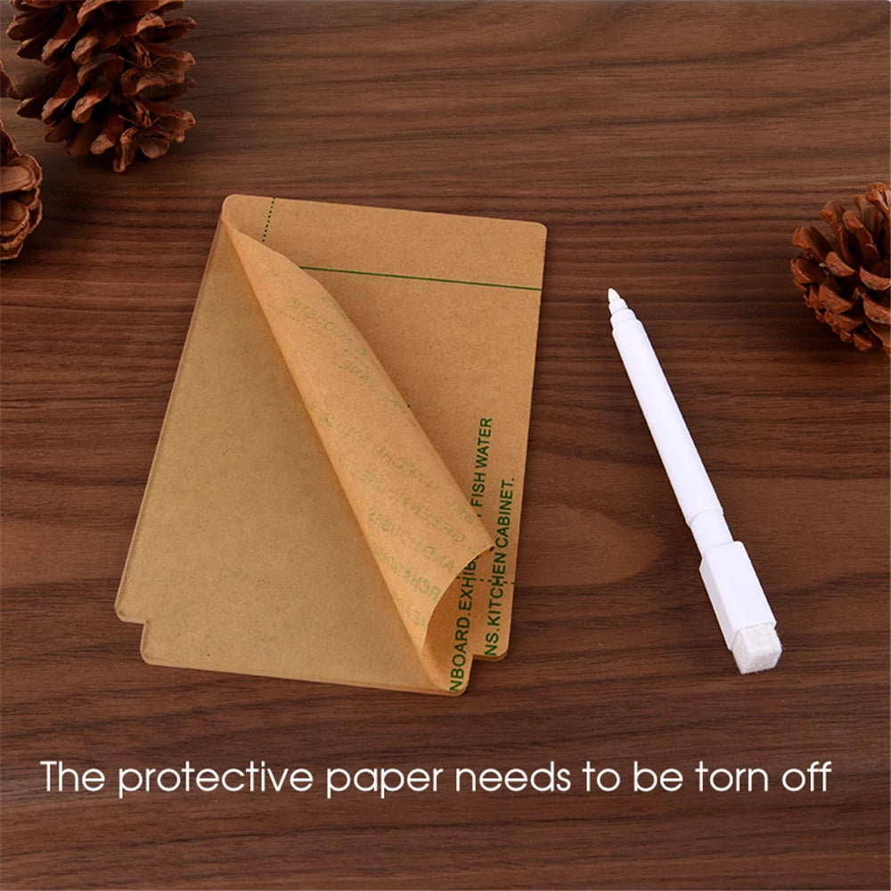 Kraft paper envelope with a white pen on a wooden surface