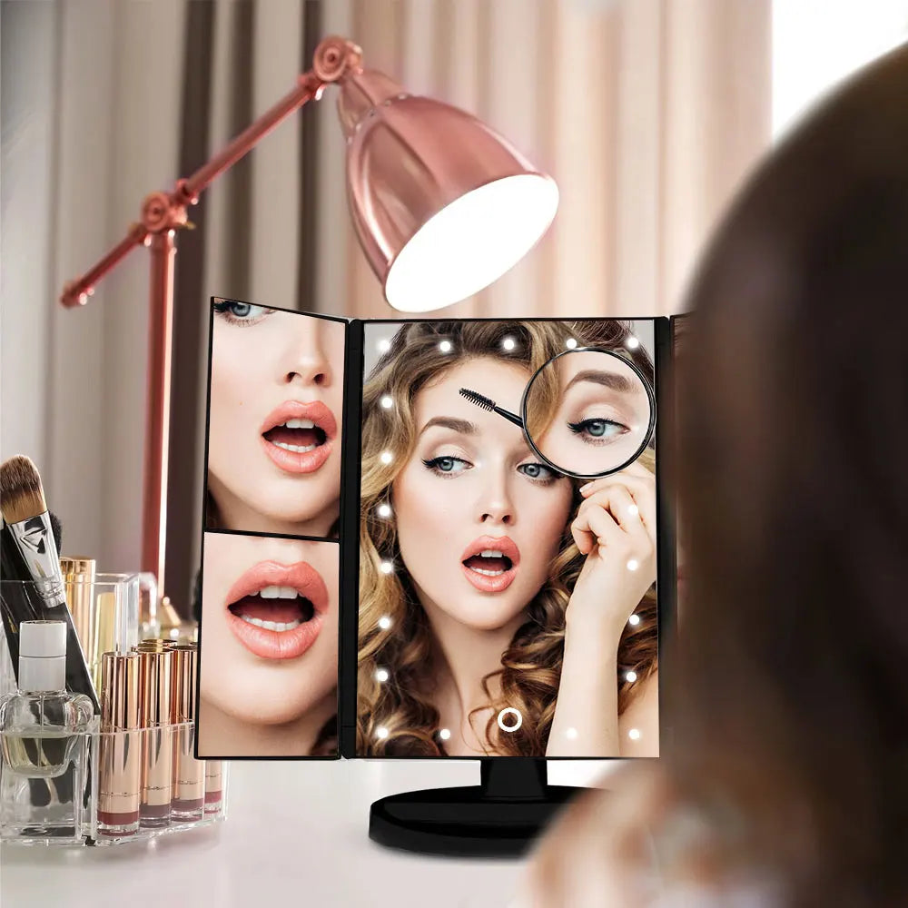 Makeup mirror with multiple screens displaying a woman's face, surrounded by makeup brushes and products.