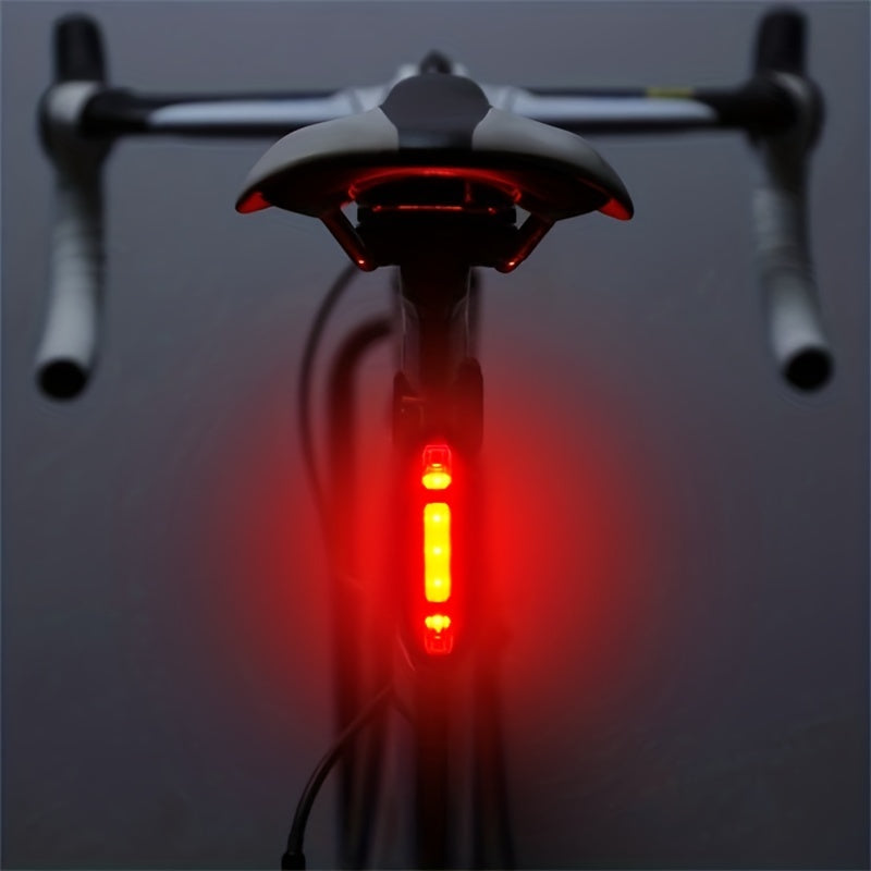 Bicycle tail light on a dark background