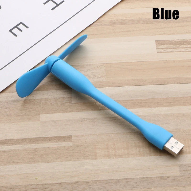 Blue USB device on a wooden surface with 'Blue' text overlay