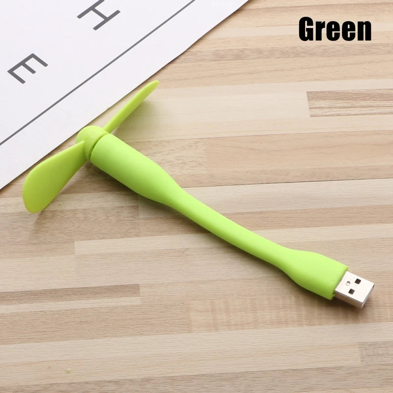 Green USB cable on a wooden surface with 'Green' text above.