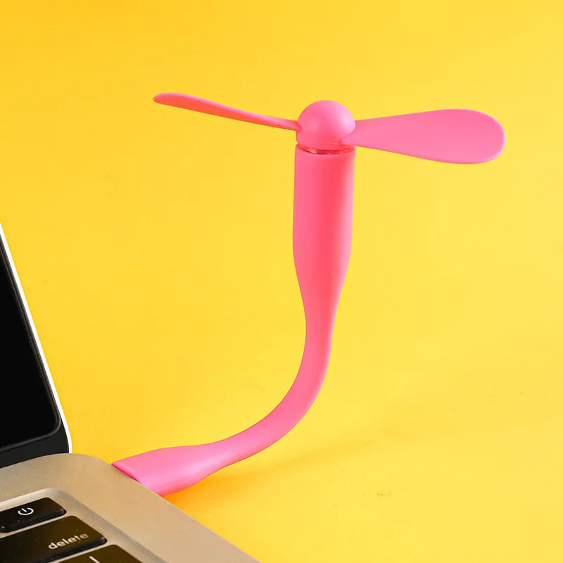 Pink USB desk fan on a yellow background