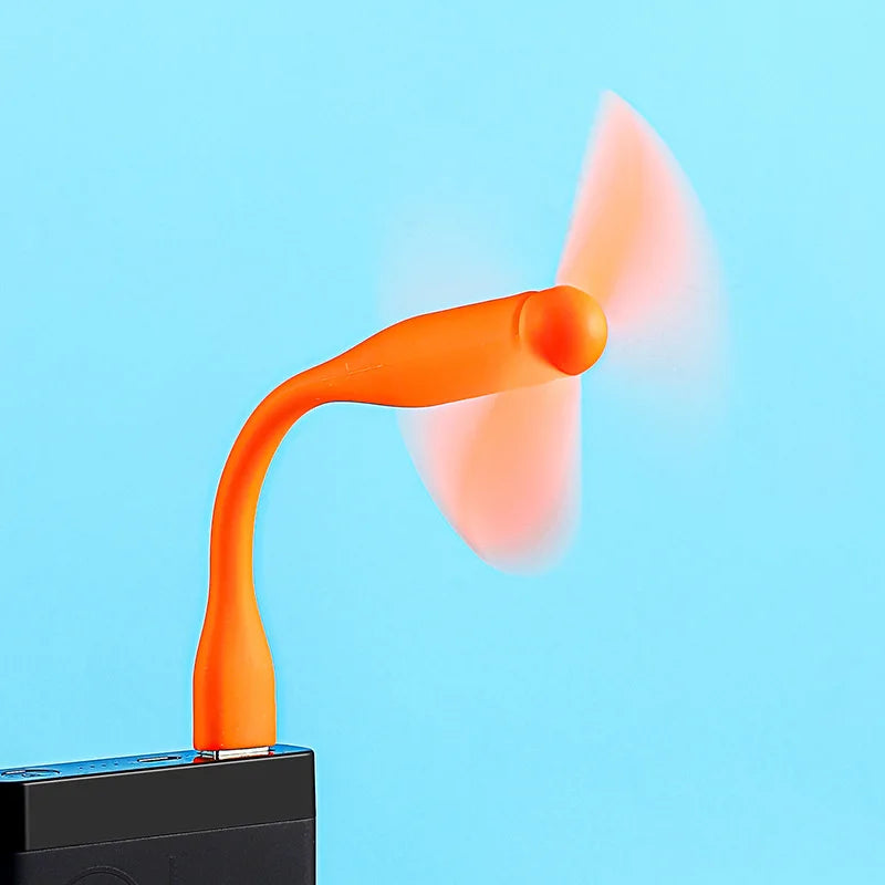 Orange USB fan on a blue background