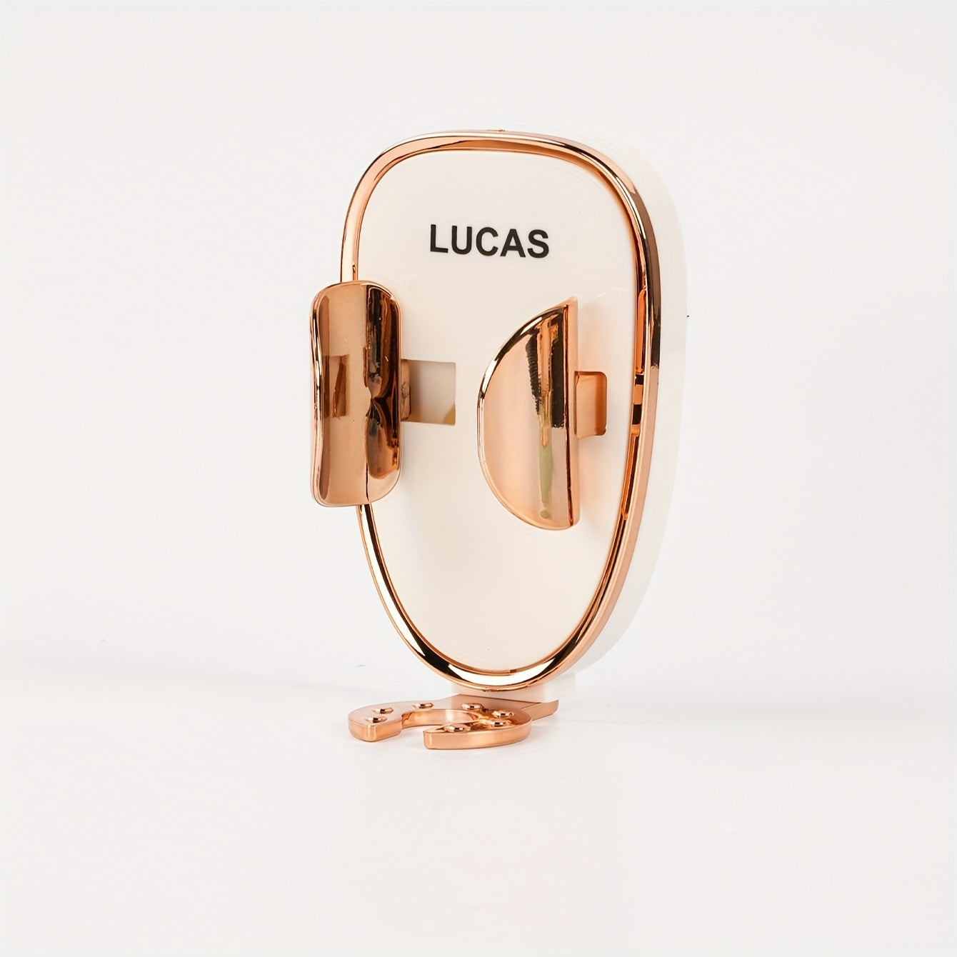 Rose gold ring with 'LUCAS' branding on a white background