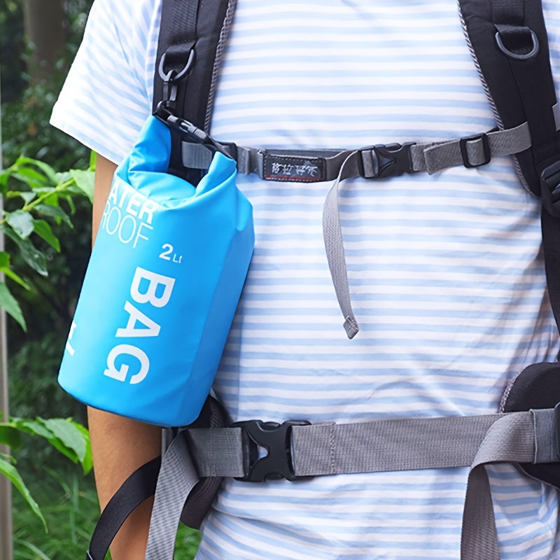Person wearing a blue dry bag with text on a striped shirt outdoors