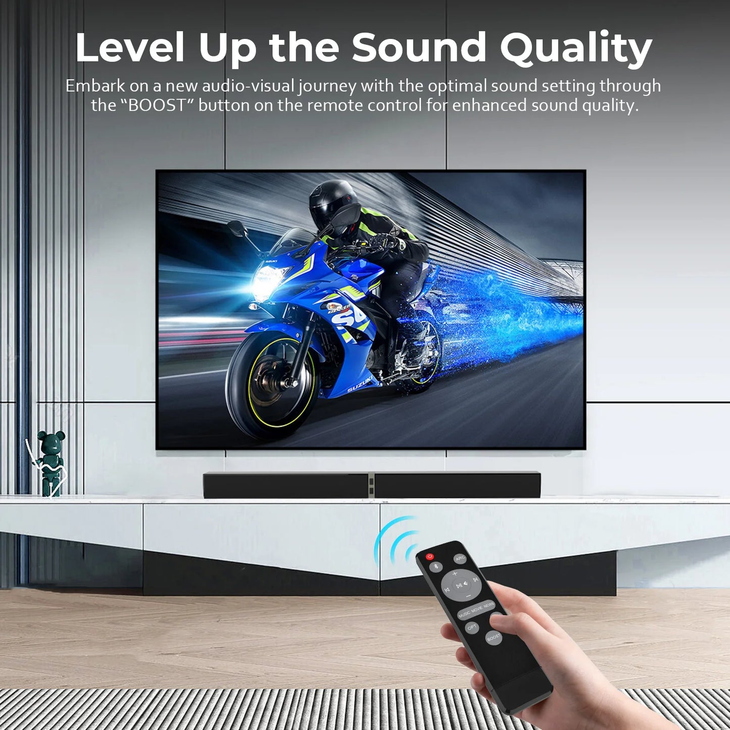 TV screen displaying a motorcycle graphic with a remote control held by a hand, emphasizing enhanced sound quality.