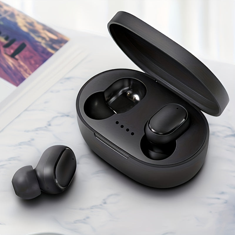 Black wireless earbuds with charging case on a marble surface