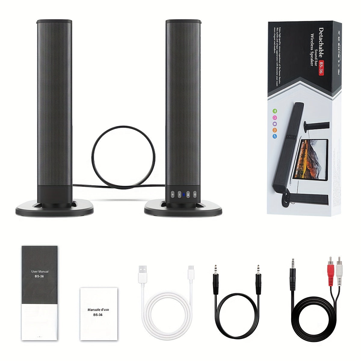 Set of black cylindrical speakers with packaging, cables, and manuals on a white background