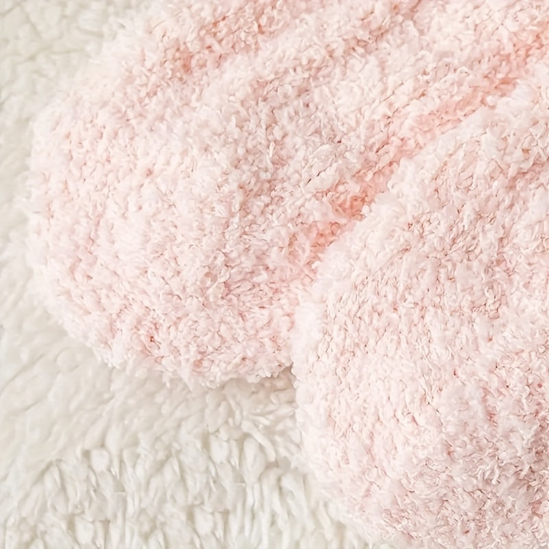 Close-up of pink textured yarn on a white background