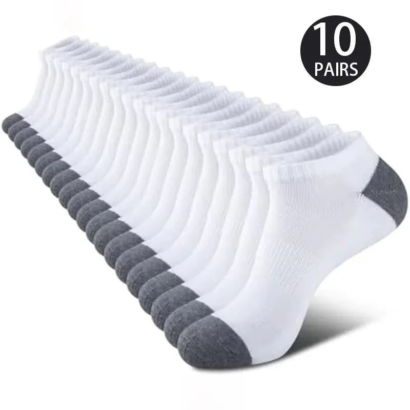 10 pairs of white ankle socks with gray toes and heels on a white background