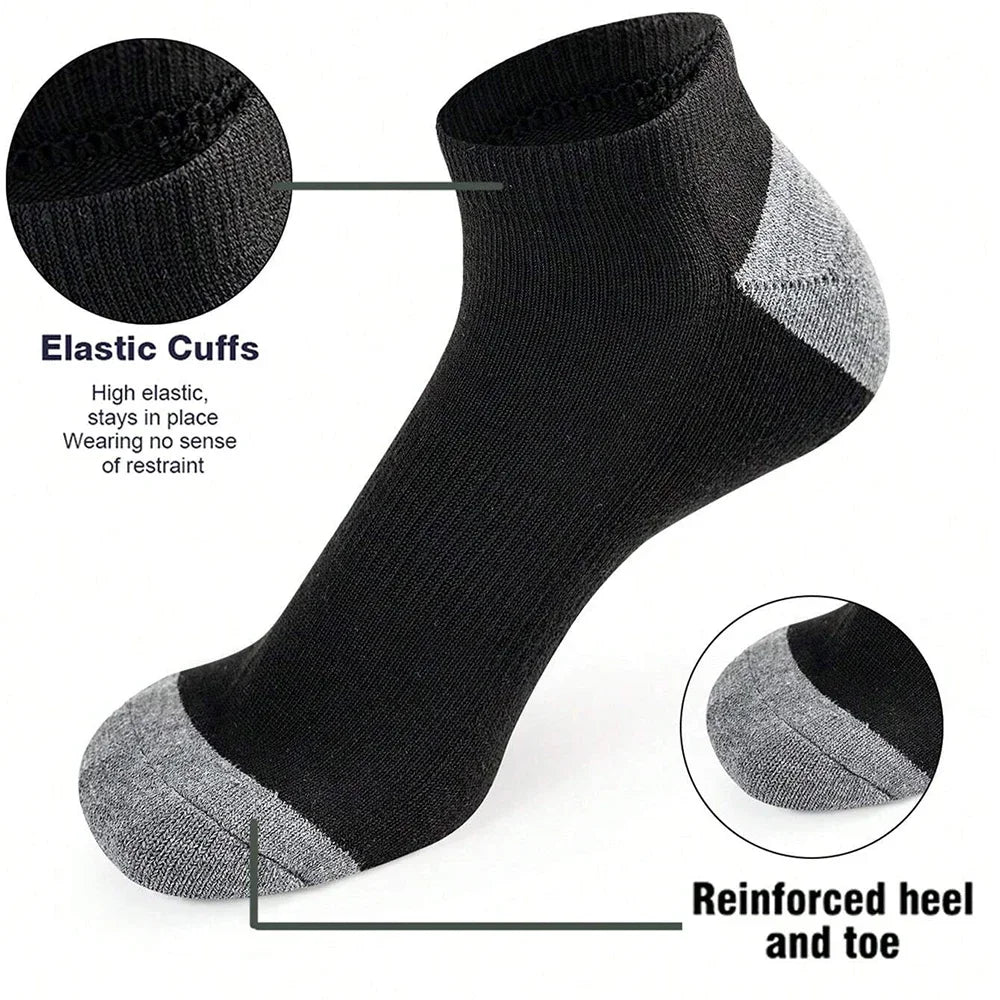 Black ankle sock with gray accents, highlighting elastic cuffs and reinforced heel and toe on a white background.