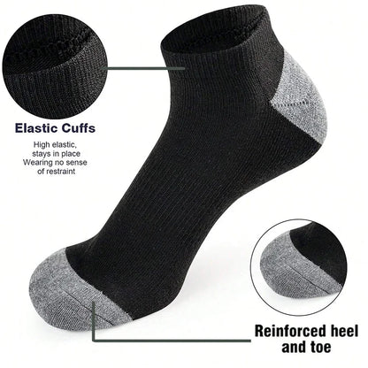 Black ankle sock with gray accents, highlighting elastic cuffs and reinforced heel and toe on a white background.