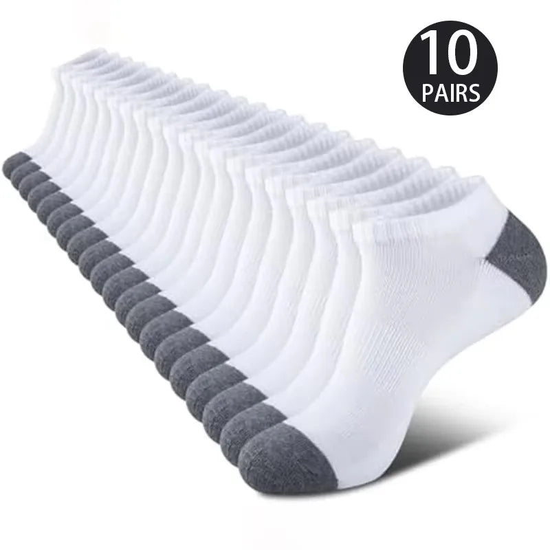 10 pairs of white ankle socks with gray toes and heels on a white background