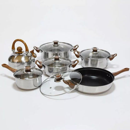 Set of cookware including pots, pans, and lids on a white background