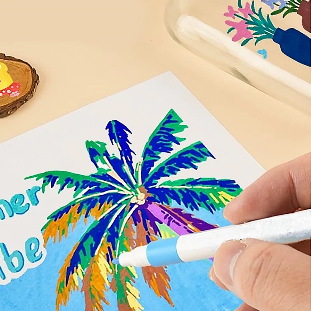 Colorful palm tree drawing on paper with a hand holding a marker.