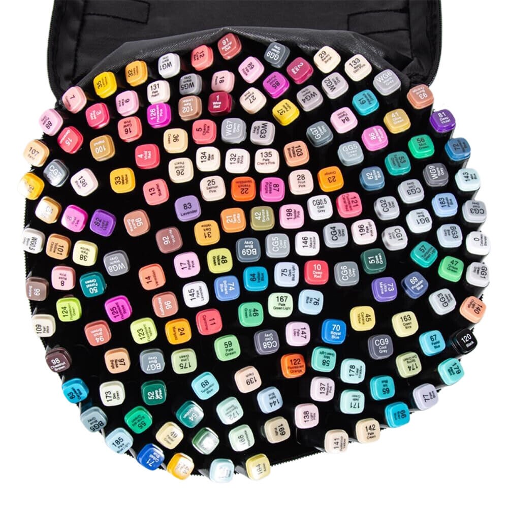 Collection of colorful markers on a black mat with a grid pattern