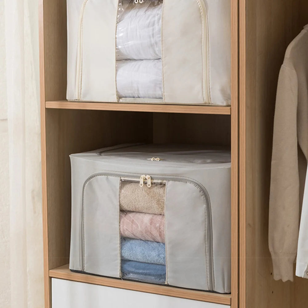 Foldable storage bags with clothes inside on a wooden shelf.