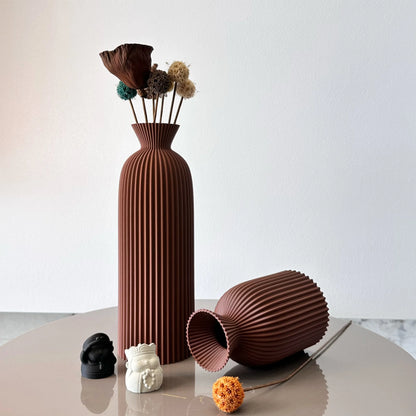 Brown textured vase with flowers on a white background