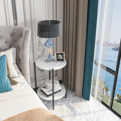 Modern bedroom with a bed, side table, lamp, and city view.