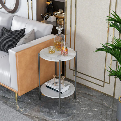 Small round side table with marble top in a living room setting.