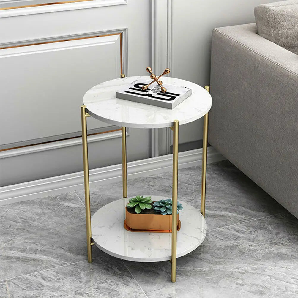 Small round marble table with gold legs in a living room setting
