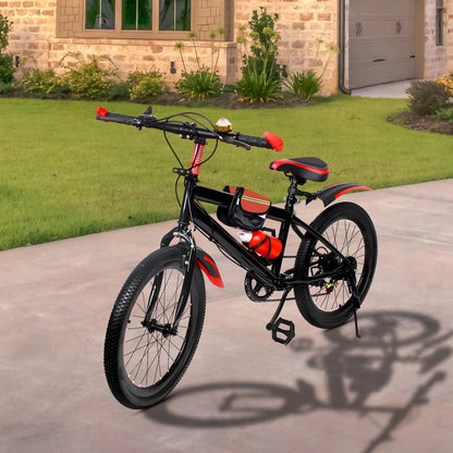 Black and red bicycle parked on a driveway in front of a house.
