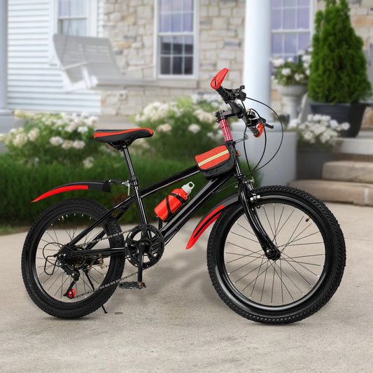 Black and red children's bicycle on a patio with a house in the background