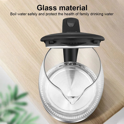 Glass water boiler with black lid on a wooden surface, text about glass material and water safety.