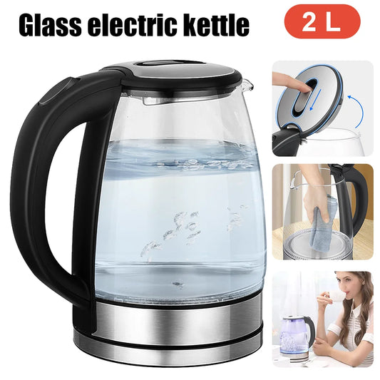 Glass electric kettle with black handle and base, filled with water, on a white background.