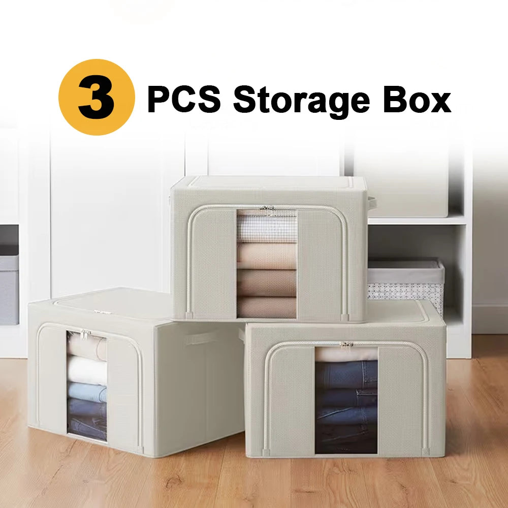 Three storage boxes with transparent lids showing folded clothes, placed on a wooden floor.