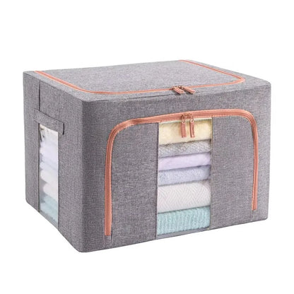 Gray storage box with pink trim containing folded clothes on a white background