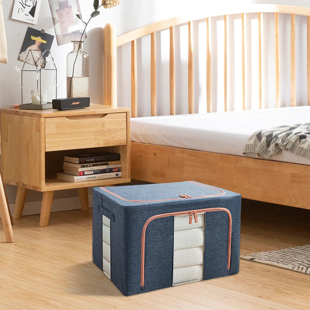 Blue storage ottoman in a bedroom setting with a wooden nightstand and bed.