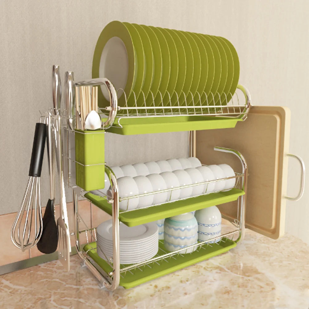 Green dish rack with cutlery holder on a kitchen counter