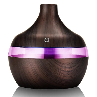 Wooden diffuser with a purple light band on a white background