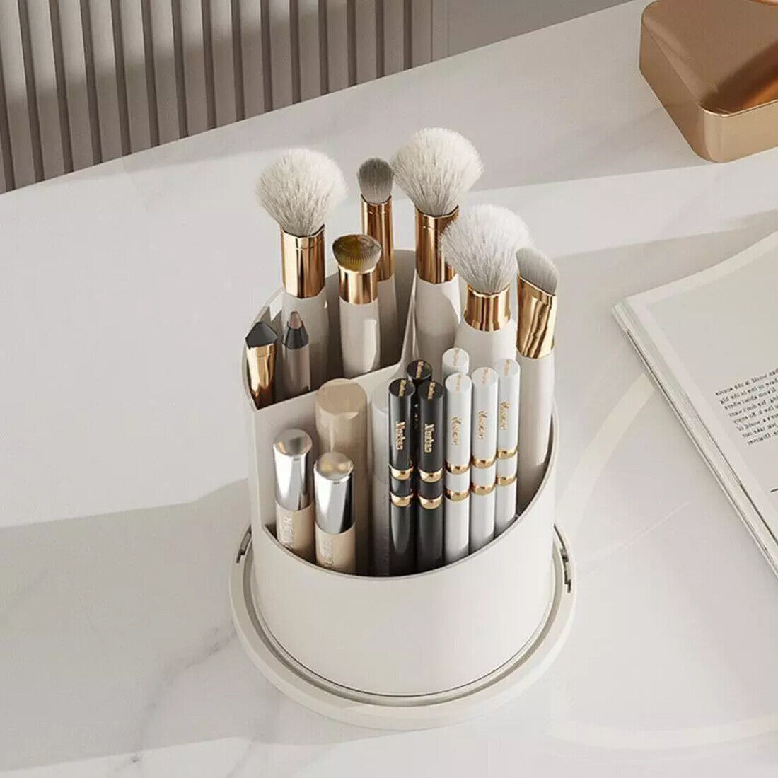 Makeup brush set in a white holder on a light surface