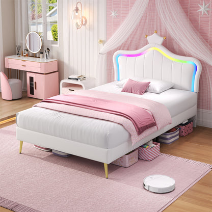 Children's bedroom with a white bed, pink bedding, and rainbow headboard.