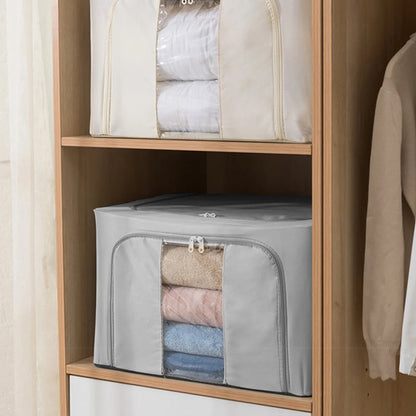 Foldable storage bags with clothes inside on a wooden shelf.