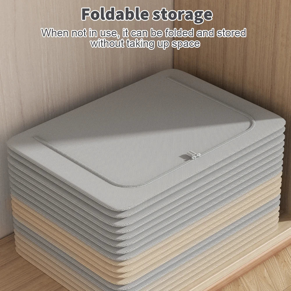 Stack of gray and beige folded storage mats on a wooden shelf.