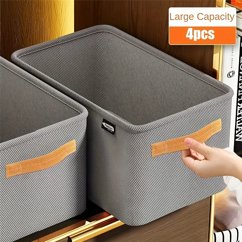 Gray storage bins with brown handles on a wooden surface, labeled 'Large Capacity 4pcs'.