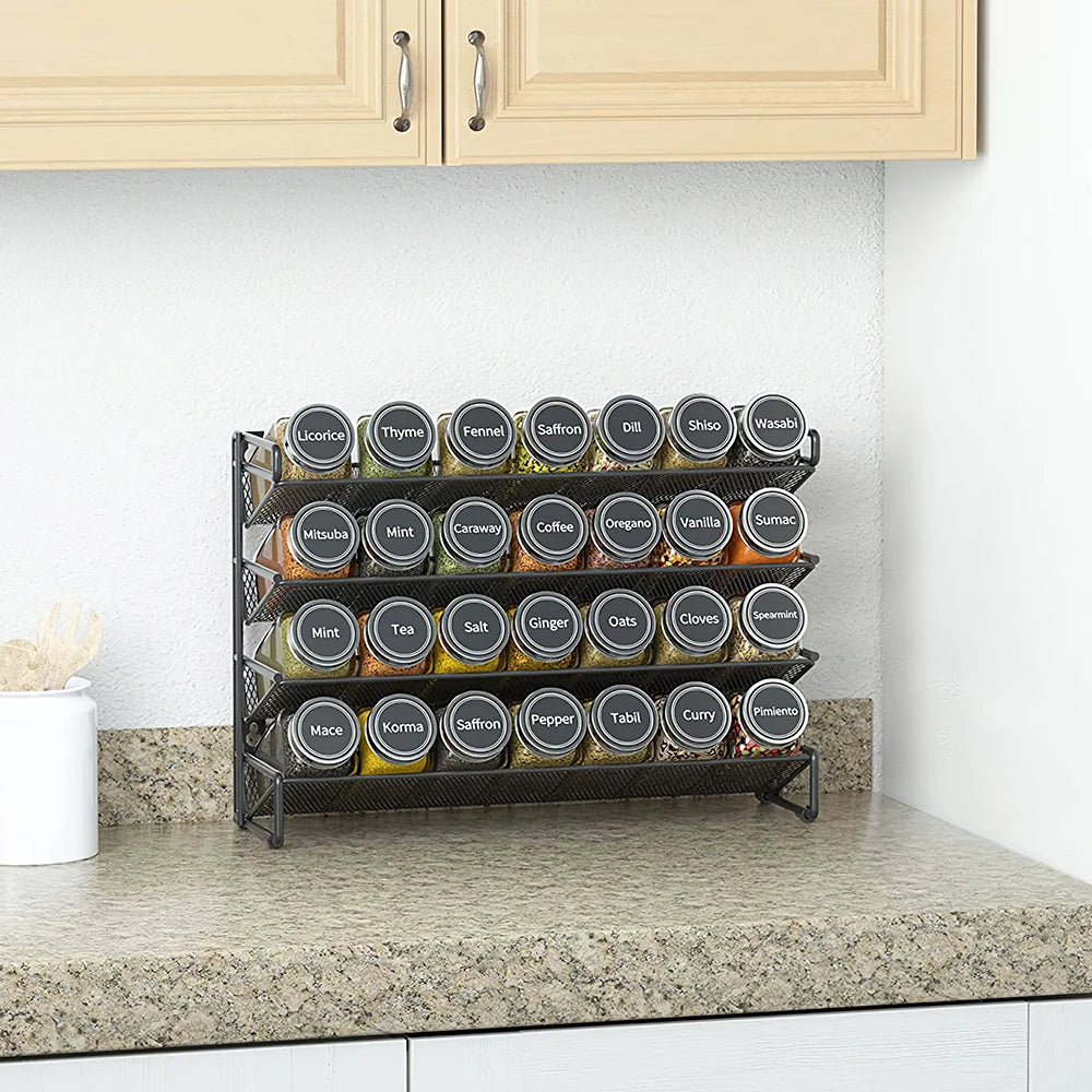Spice rack with labeled jars on a kitchen counter