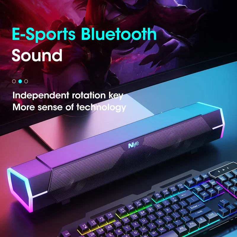 Gaming setup with Bluetooth soundbar, keyboard, and monitor on a dark background