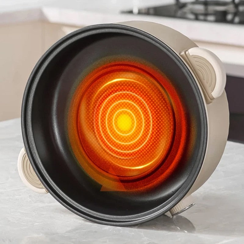 Hot plate with glowing heating element on a kitchen counter