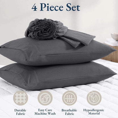 Gray bedding set with four pieces on a bed, featuring durable, easy care, breathable, and hypoallergenic properties.