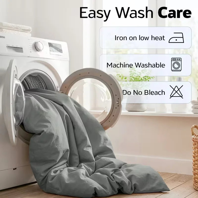 Gray comforter draped over a washing machine with care instructions displayed.