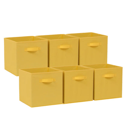 Set of six yellow storage cubes with handles on a white background