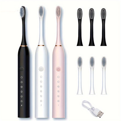 Set of electric toothbrushes with additional brush heads on a white background