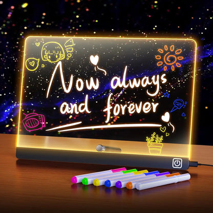 Light-up writing board with 'Now always and forever' text and colorful markers on a wooden surface.